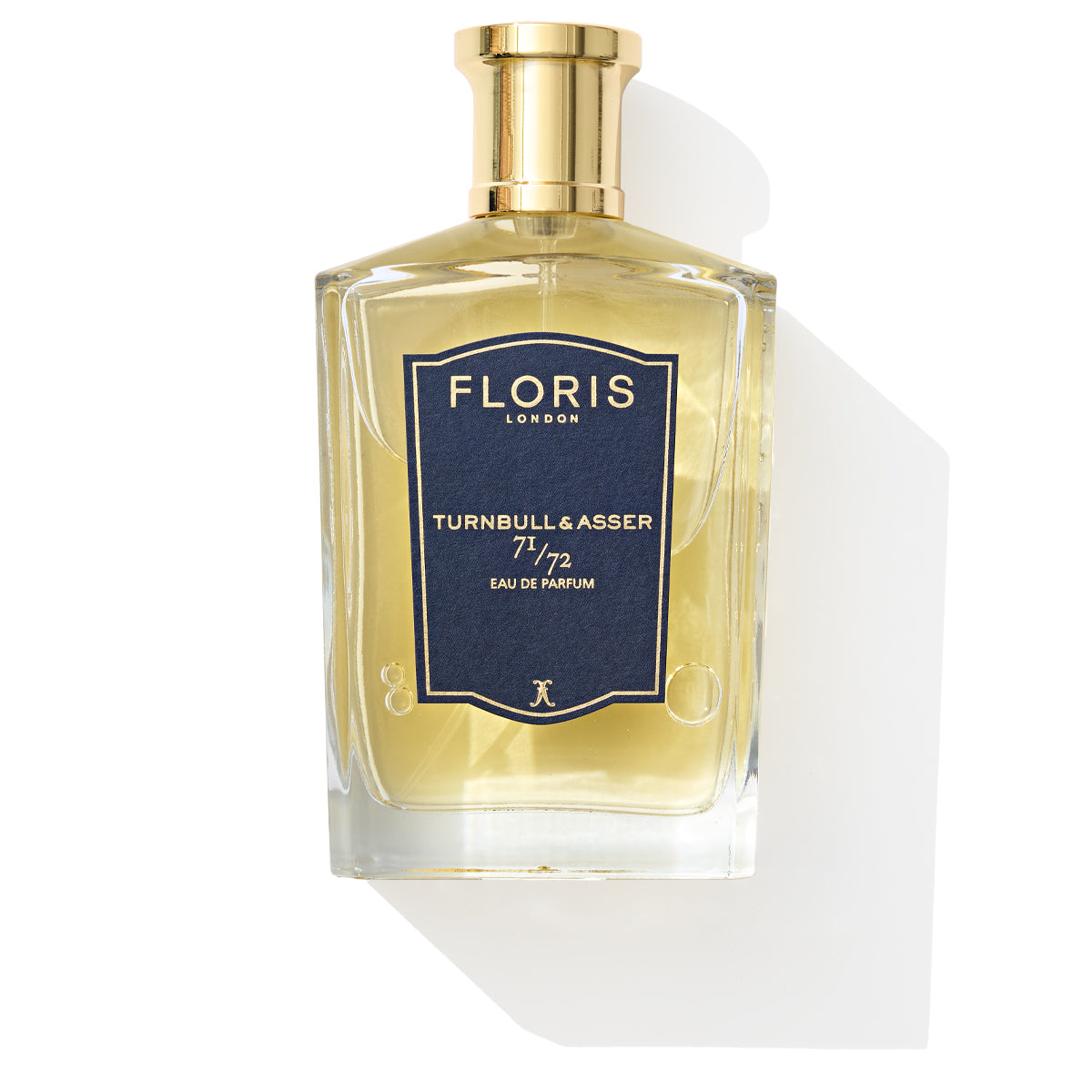 A Floris London 71/72 Eau de Parfum with a gold cap and a woody scent on a white background.