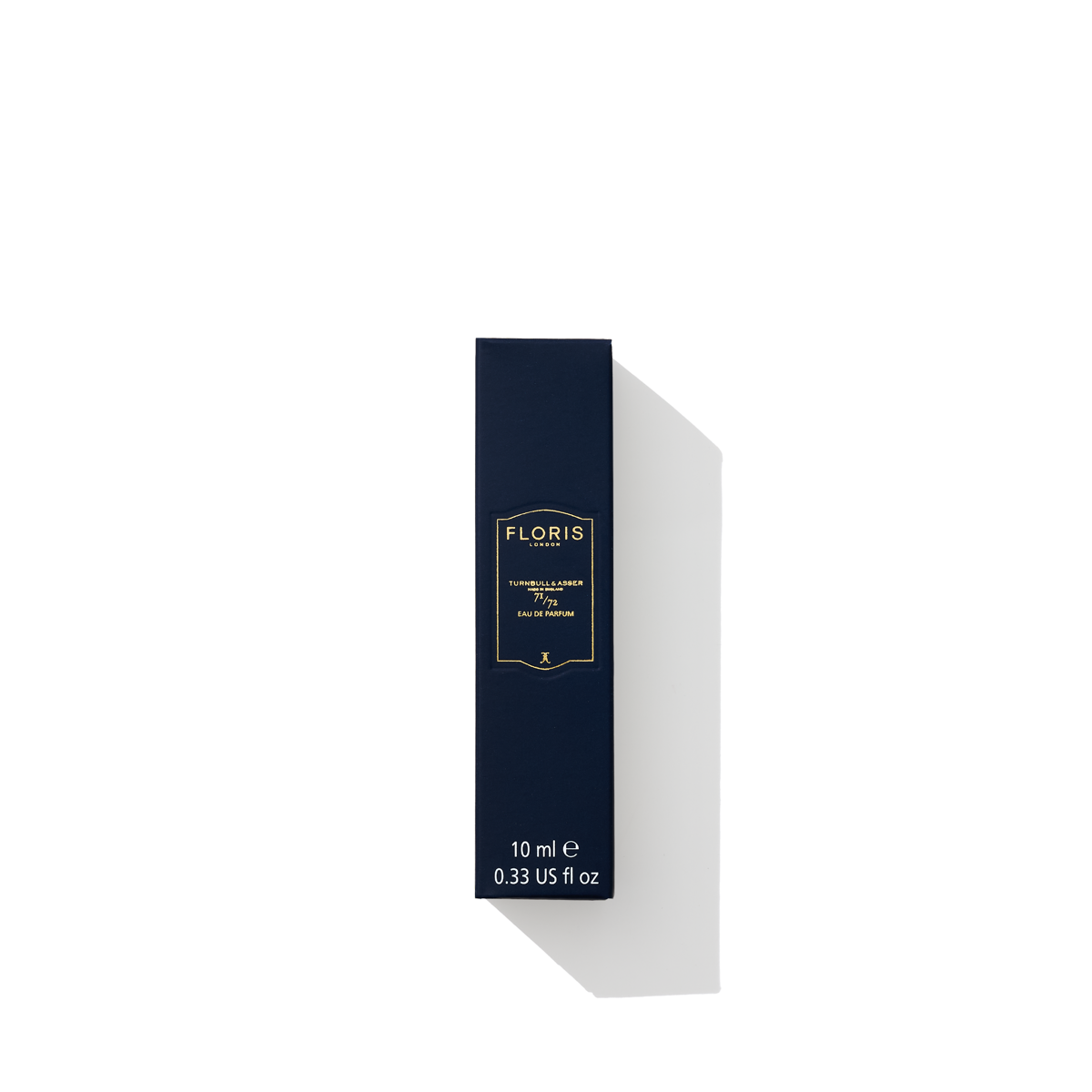 A small, dark blue rectangular box of Floris London 71/72 - Eau de Parfum woody fragrance, labeled "10 ml, 0.33 US fl oz", stands against a white background.