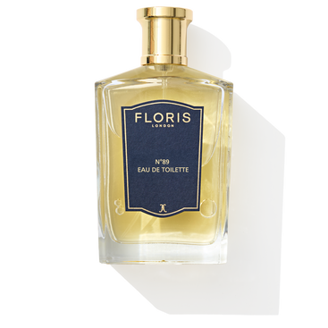 Floris London's No. 89 Eau de Toilette features orange and bergamot notes in a clear glass bottle with a gold cap and navy blue label.