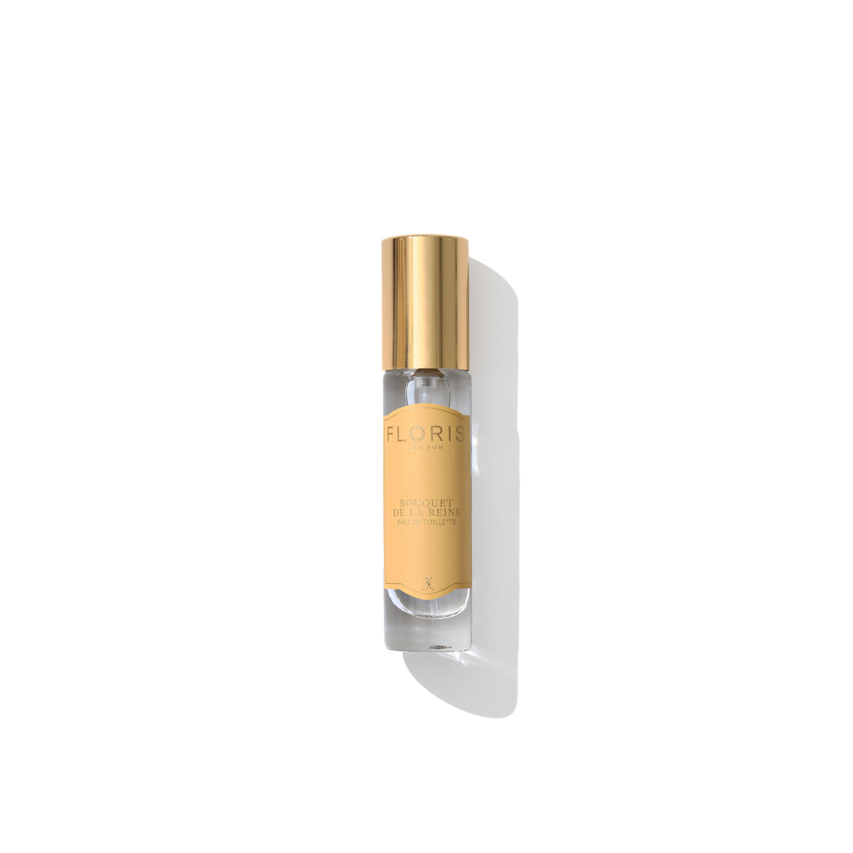 A transparent bottle with a gold cap labeled "Bouquet de La Reine - Eau de Toilette" by Floris London stands upright on a white background, exuding a fruity floral essence.