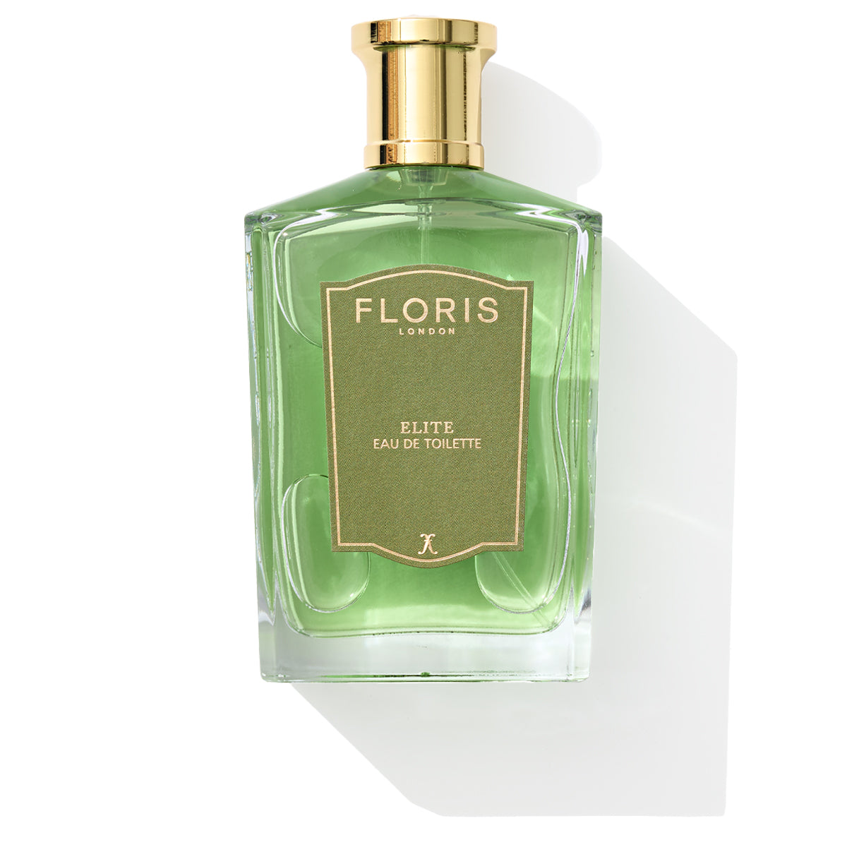 A bottle of Floris London's Elite Eau de Toilette with green liquid, woody notes, and a gold cap.