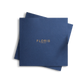 A square-shaped booklet with a navy blue cover featuring the gold-embossed text 'FLORIS LONDON' cantered on the front.