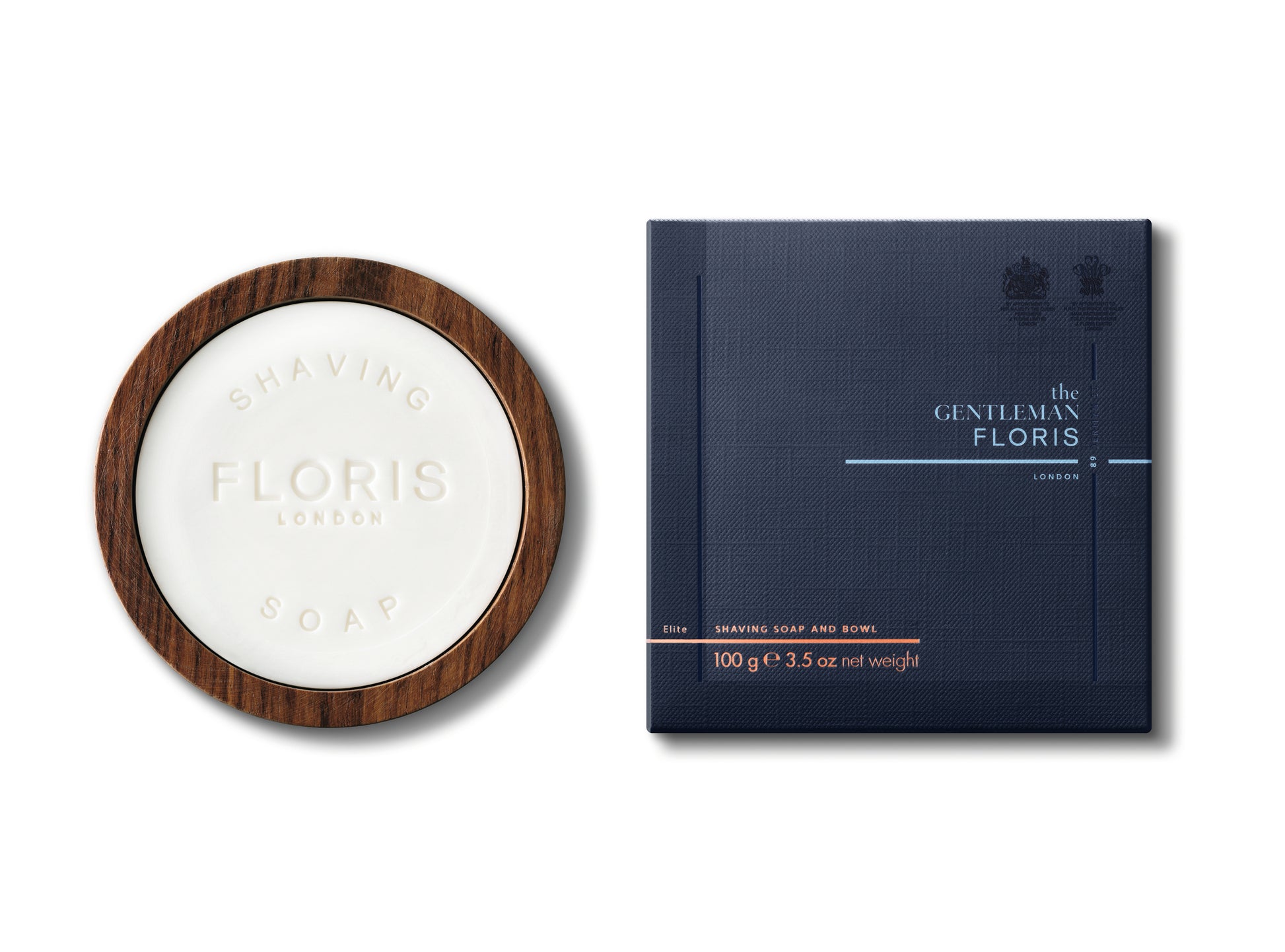 An Elite - Shaving Soap & Bowl from Floris London, enriched with shea butter, sits beside its blue square packaging, both elegantly labeled "The Gentleman Floris.