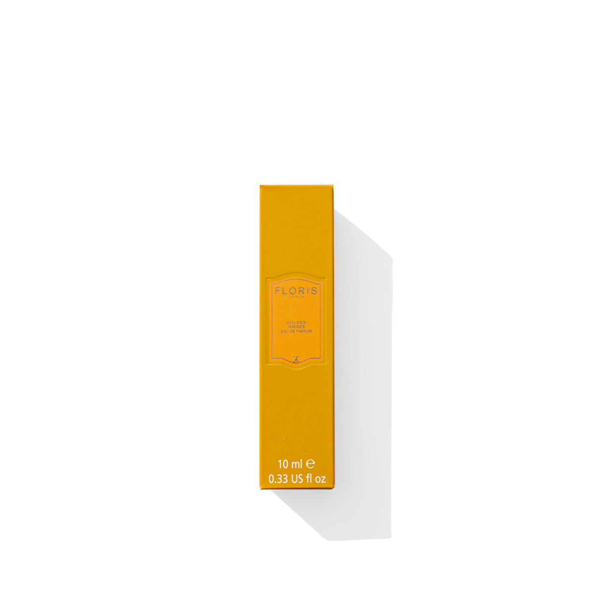 A rectangular orange box of Golden Amber - Eau de Parfum by Floris London, containing 10 ml (0.33 US fl oz) with a shadow cast to the right and notes of Golden Amber.