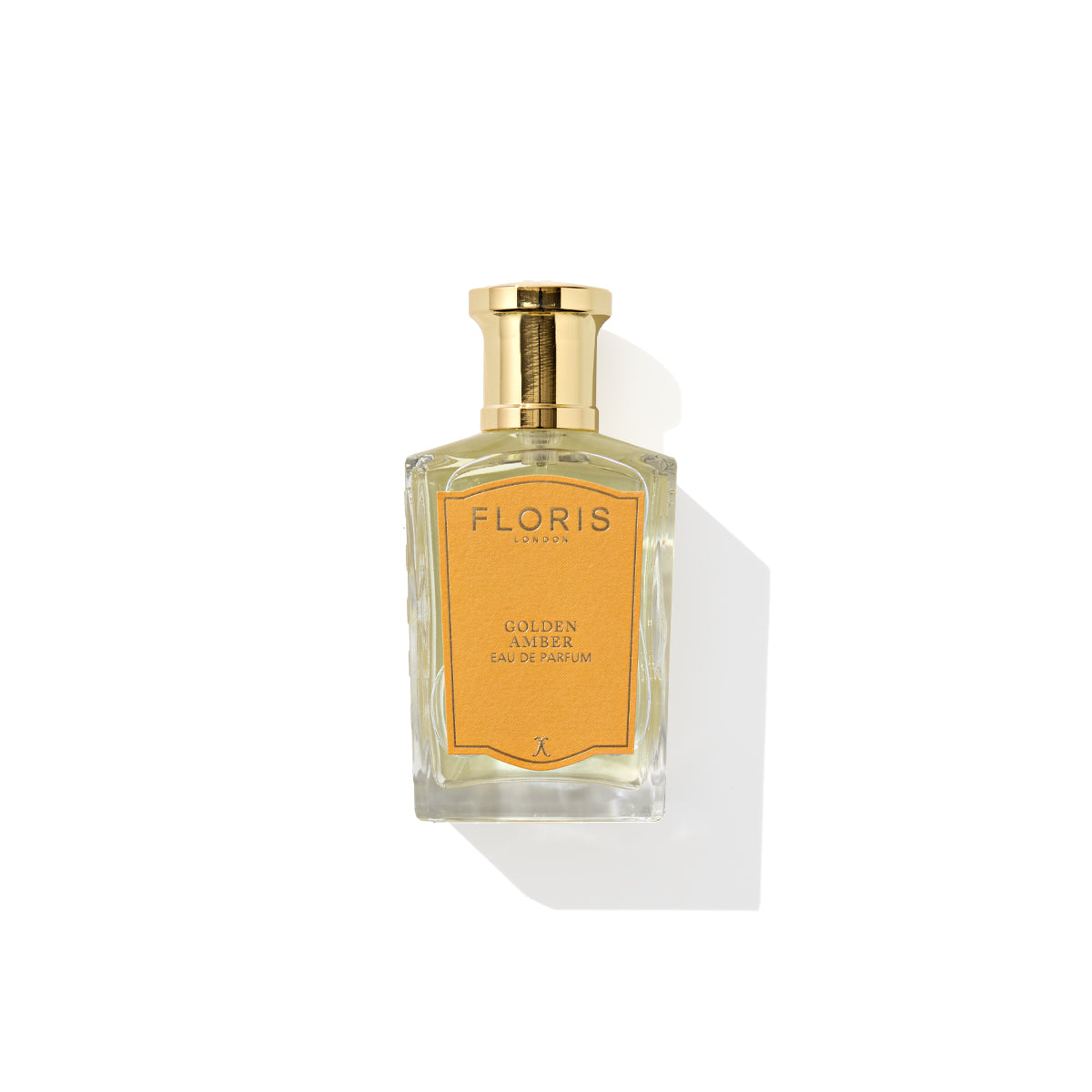 Golden Amber - Eau de Parfum by Floris London, showcasing a striking gold cap and an amber-colored label, isolated on a white background. This exquisite vegan fragrance captivates with its opulent presentation.