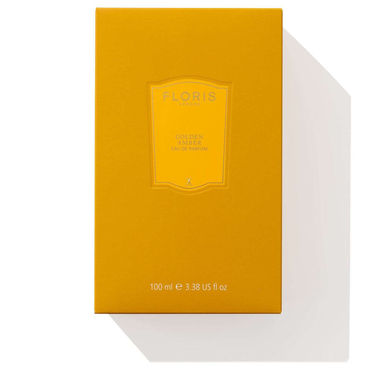 A bright yellow box of Floris London's Golden Amber - Eau de Parfum, 100 ml, showcasing a vegan formula.