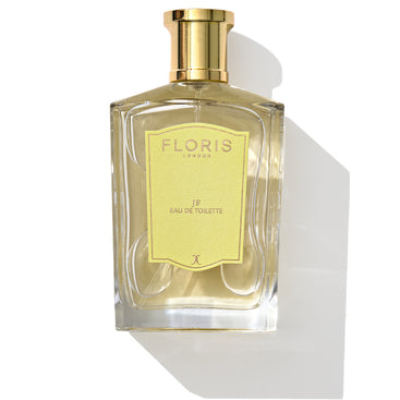 The Floris London JF - Eau de Toilette features a clear glass bottle with a gold cap and a yellow label, delivering a sophisticated fragrance for men highlighted by citrus and woody notes.