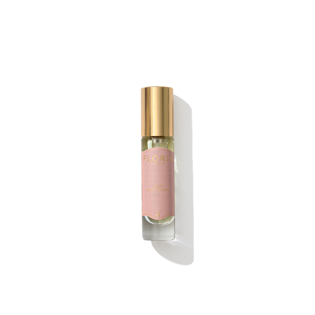 A small perfume bottle with a gold cap and a pink label that reads "Floris London" on a white background, exuding the essence of floral fragrance with hints of Lily of the Valley, named "Lily - Eau de Toilette.