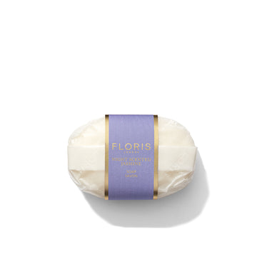 A bar of Floris London's Night Scented Jasmine Soap fragranced and wrapped in clear plastic with a purple and gold label.