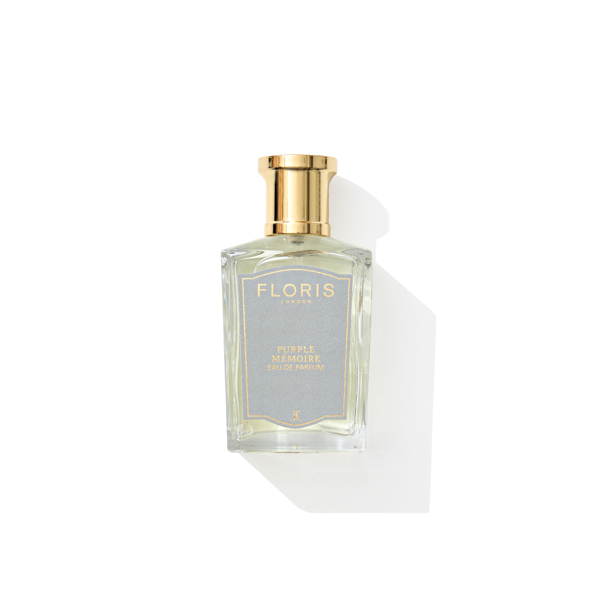 Purple Mémoire - Eau de Parfum bottle, by Floris London UK, with a gold cap and sandalwood hints, displayed against a white background.