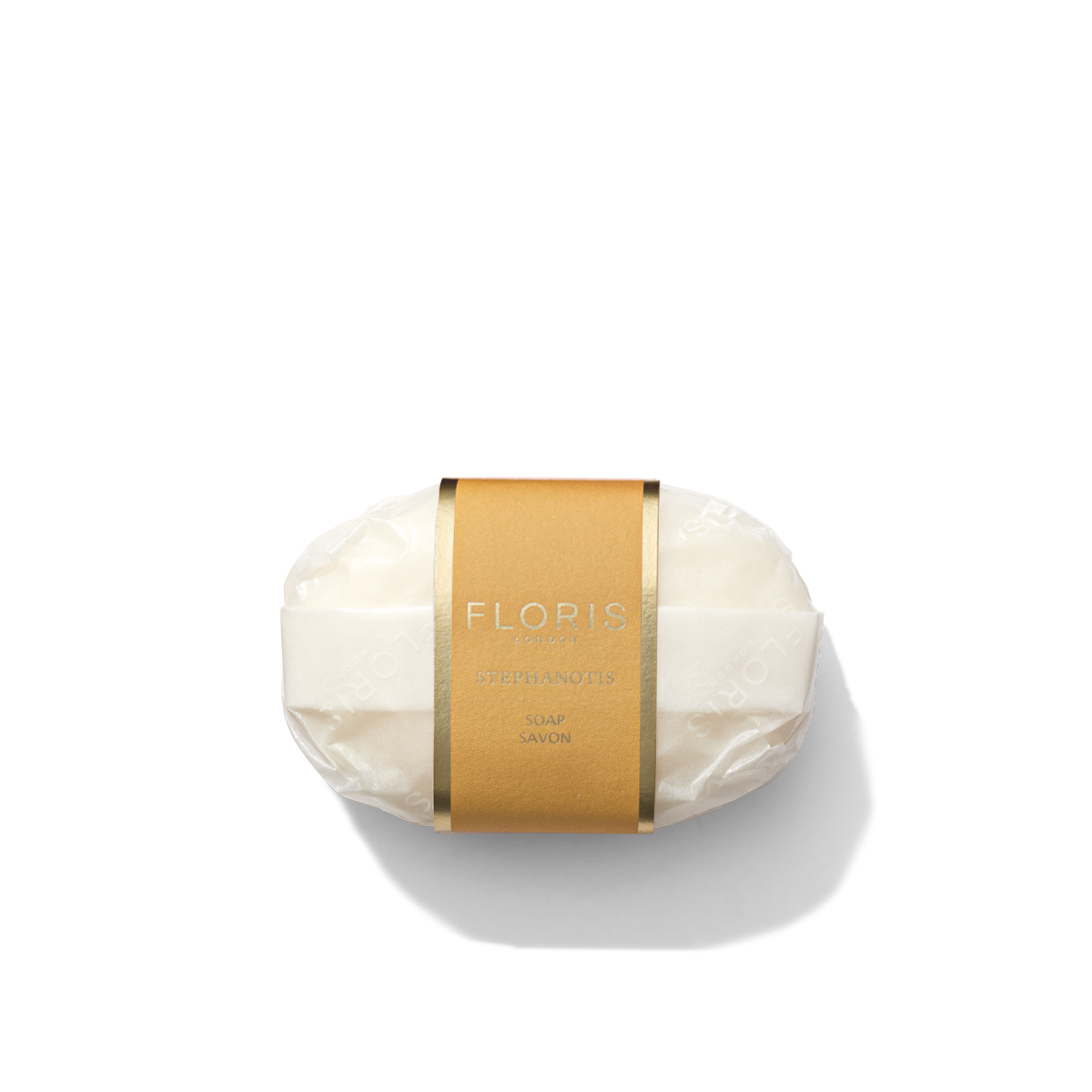 A bar of Stephanotis Soap from Floris London, wrapped in paper with a brown Floris label in the center.