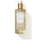 A bottle of Floris London's White Rose - Luxury Hand Wash, 250 ml, features a gold pump and an elegant beige label. Infused with coconut ingredients for a luxurious cleanse, this hand wash exudes a delightful White Rose scent.